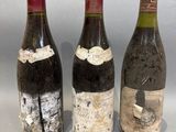 three bottles of wine sitting next to each other on a table