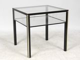 an image of a glass and brass side table on a white background