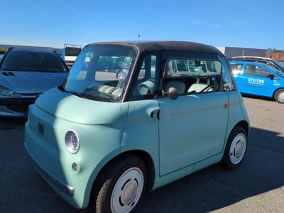 a small car that is parked in a parking lot