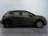 the small car is parked on the concrete floor in the room