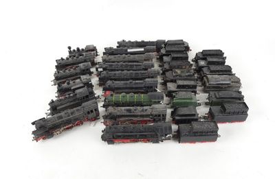 a lot of black and red trains on a white surface