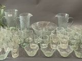 a lot of glass items that are sitting on a table