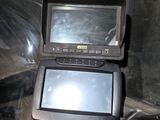 an image of a vehicle with a monitor on the dashboard
