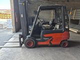 a forklift that is parked in a garage