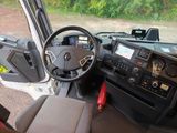 a steering wheel and dashboard of a bus