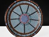 a blue and brown plate with a star design on it