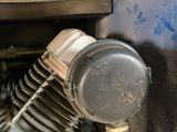 a close up view of a motorcycle engine with a gas tank