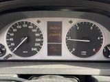 a close up of a car dashboard with a speedometer and other gauges