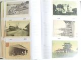 an open book with pictures of old cars and buildings on it
