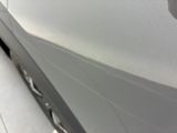 a close up of a white car with a black stripe