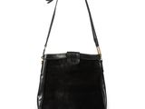 a black purse with a gold handle and a black strap