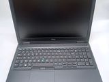 the dell laptop is open and ready to be used