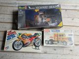 a box with a picture of a motorcycle and a box with a picture of a truck