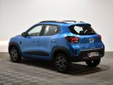the rear end of a blue car parked in a room