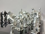 a lot of chess pieces that are on the table
