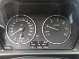 a close up of a car dashboard with a speedometer and other gauges