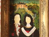 tableau représentant un couple devant un château, dans un cadre doré
