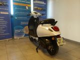 a scooter that is parked in a showroom