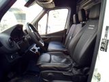 a picture of the inside of a van with black leather seats