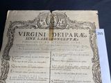 a very old book that is on a table