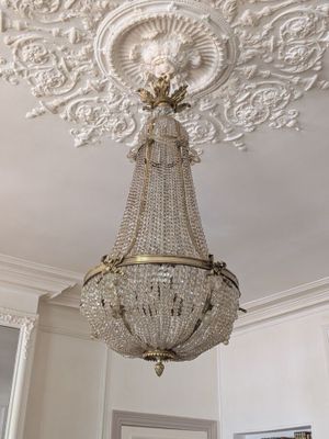 a chandelier hanging from the ceiling in a room