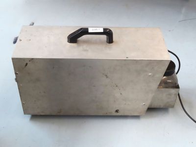 a metal box with a phone on top of it