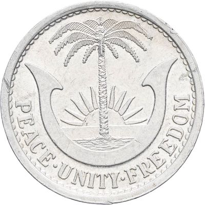 une image représentant une pièce d'argent sur laquelle figure un palmier