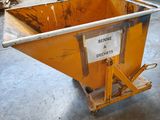 a yellow dumpster sitting in the middle of a room