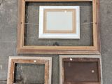 three frames that are sitting on the floor next to each other