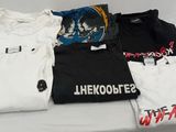 a lot of t - shirts that are on a table