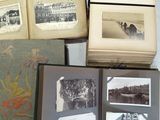 many old books with pictures on them on a table