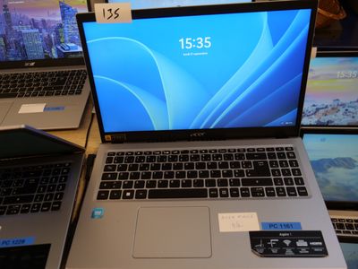 several laptops are on display at a store with price tags on them