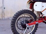 a dirt bike that is parked in the parking lot