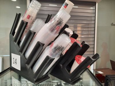 a bunch of pens that are in a holder
