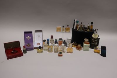 many different types of perfumes on a white surface