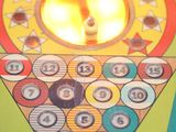 a close up of a pinball game on a table