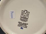 an image of a white plate with a blue and yellow design on it