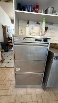 an image of a kitchen with a refrigerator and a dishwasher