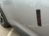 a sticker on the side of a car that has a clock on it