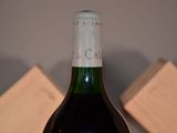 a bottle of wine that is sitting on a table