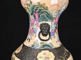 a vase with a design on it on a black background