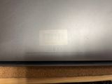 an open laptop computer sitting on top of a wooden desk