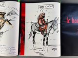 two books that are open to show a drawing of a man on a horse and a man on a horse