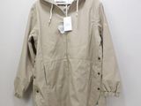 the jacket is tan and white with a hood on it