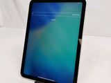 a tablet that is sitting on a stand on a table