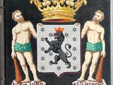 a black plaque with a lion and a lion on it