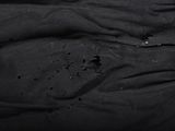 a black shirt with a hole in the middle of it