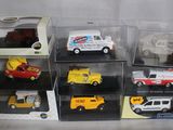 six different models of cars in a display case