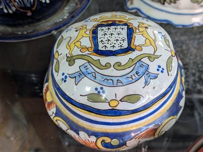 a glass case with a decorative box on it