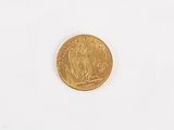 a gold coin with a picture of a man and a woman on it